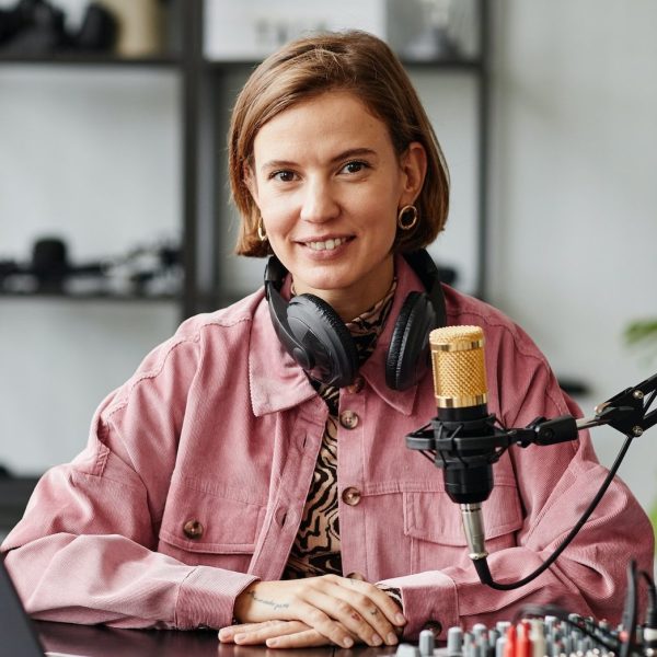 female-podcaster-smiling-e1664815088739.jpg